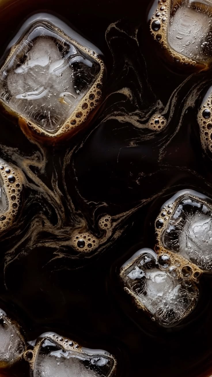Iced coffee with swirling crema