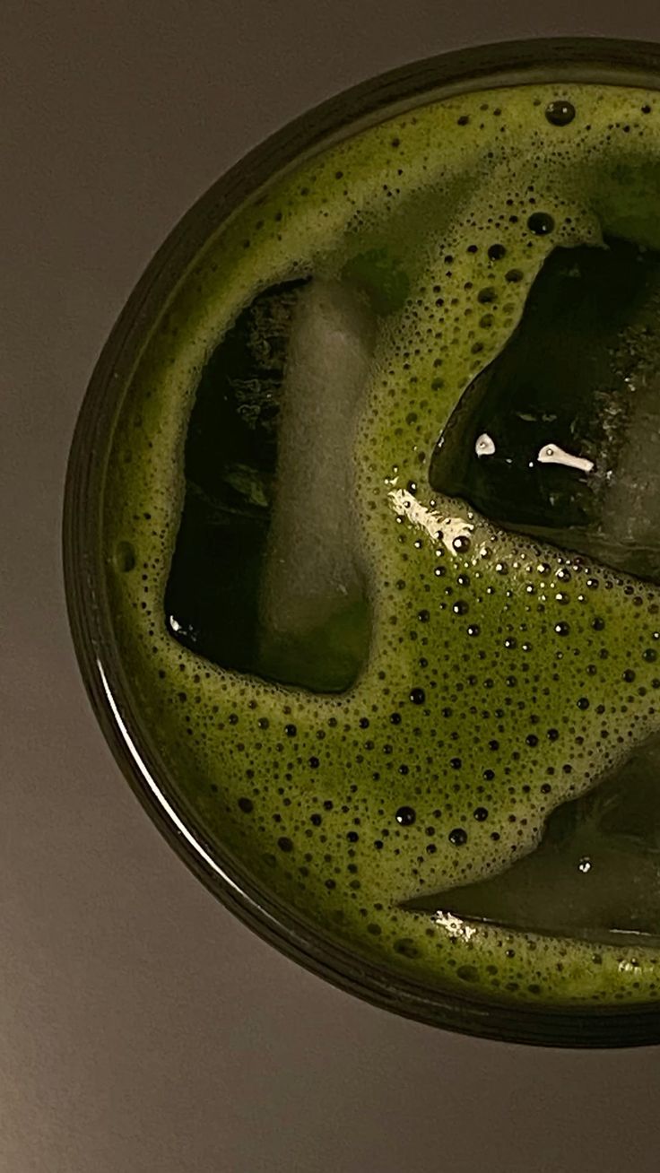 Iced matcha with a deep green foam